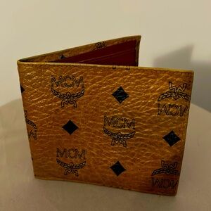 MCM Wallet classic brown color. 4 1/2 inches wide and 4 inches long.